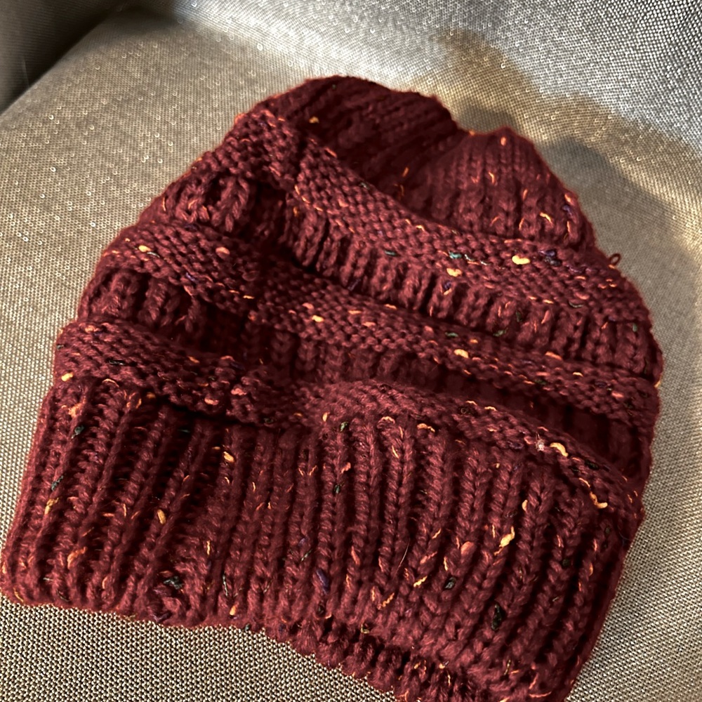 Women’s “messy bun “ beanie. Maroon. Pics won’t pick up color.